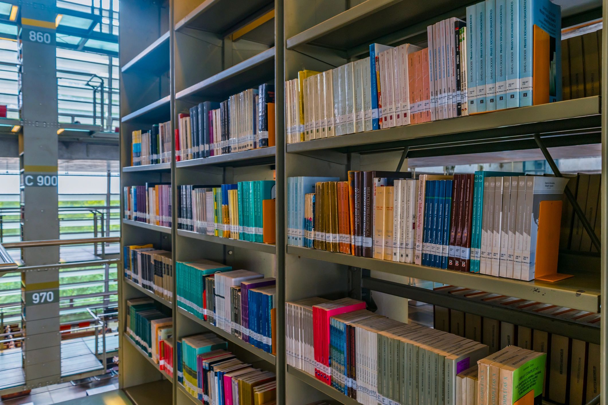 Shelves filled with books in a large library