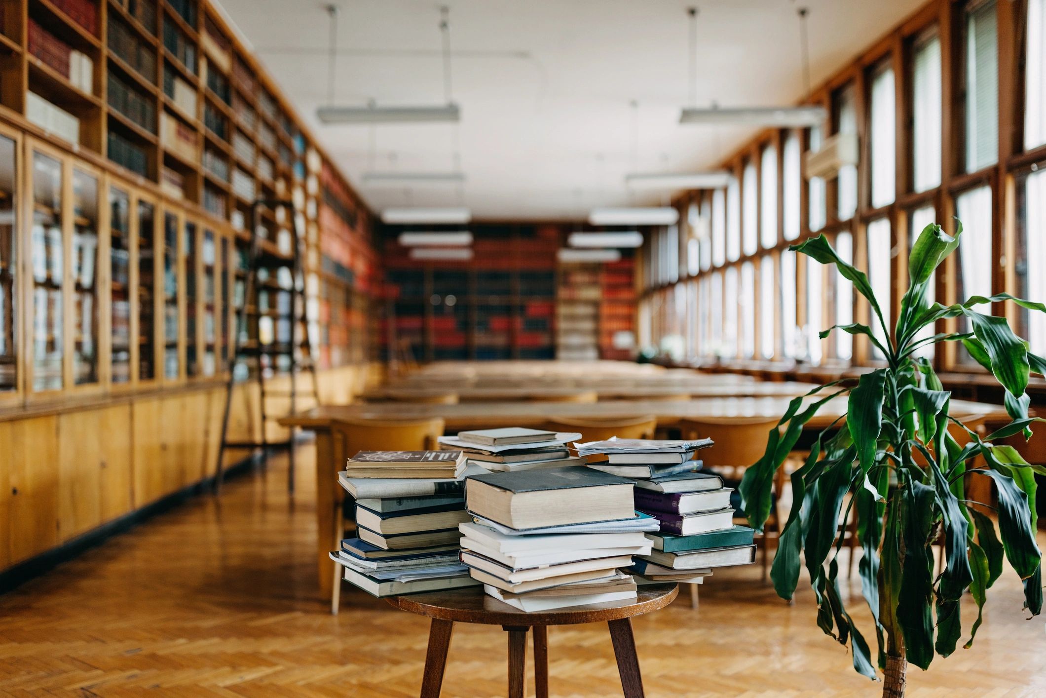 Stack of books on a study table in an academic setting